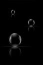 Three glass spheres on a black background Royalty Free Stock Photo